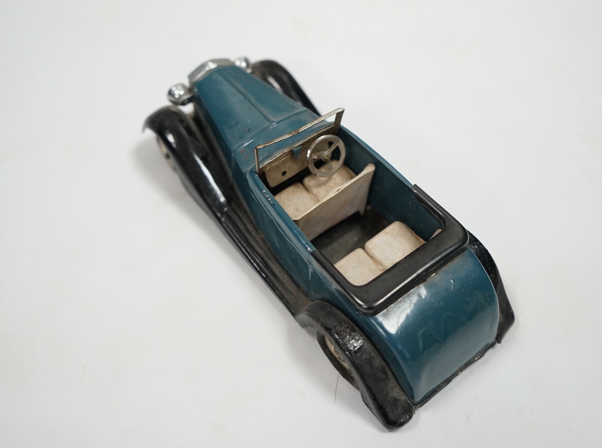 A Tri-ang Minic clockwork tinplate Rolls Royce Tourer, with aqua blue body, and black running boards, with its original box. Condition - fair, fatigue and missing parts to original tyres as would be expected, significant